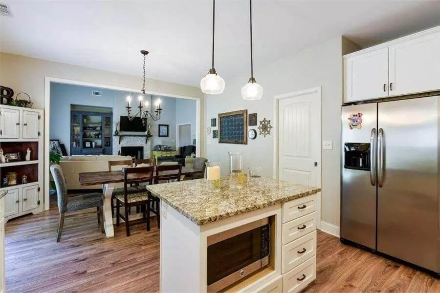 Open Kitchen Flowing into Dining and Living Room Spaces