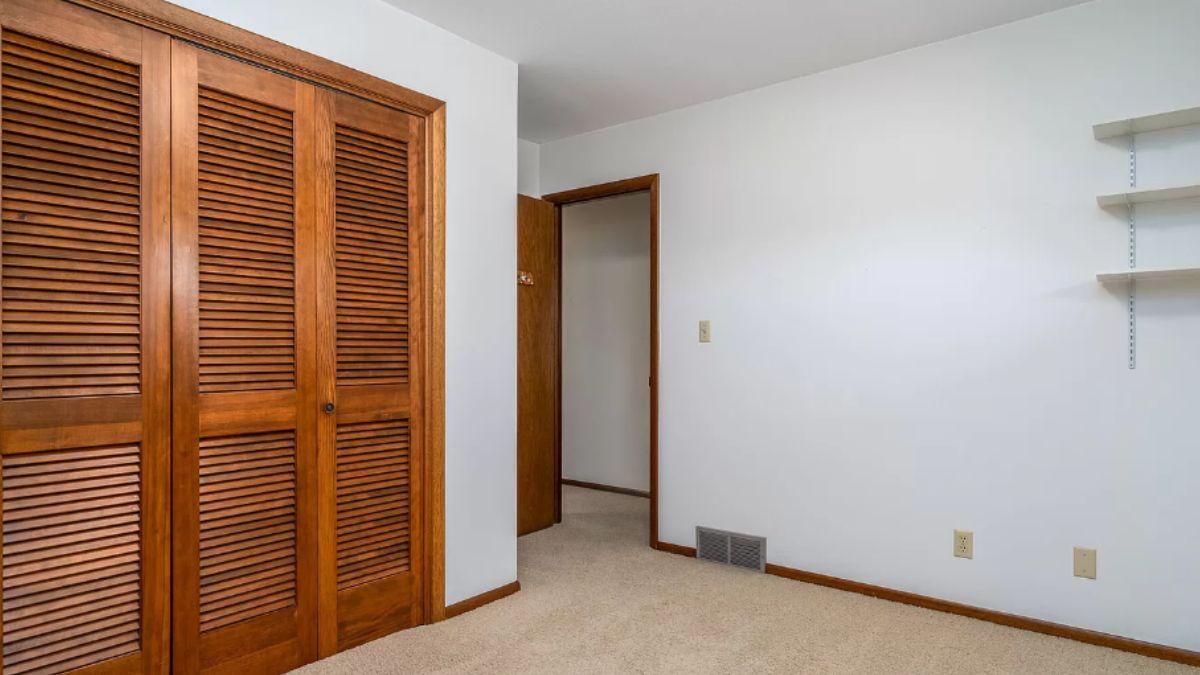 Simple Bedroom with Character-Building Louvered Closet Doors