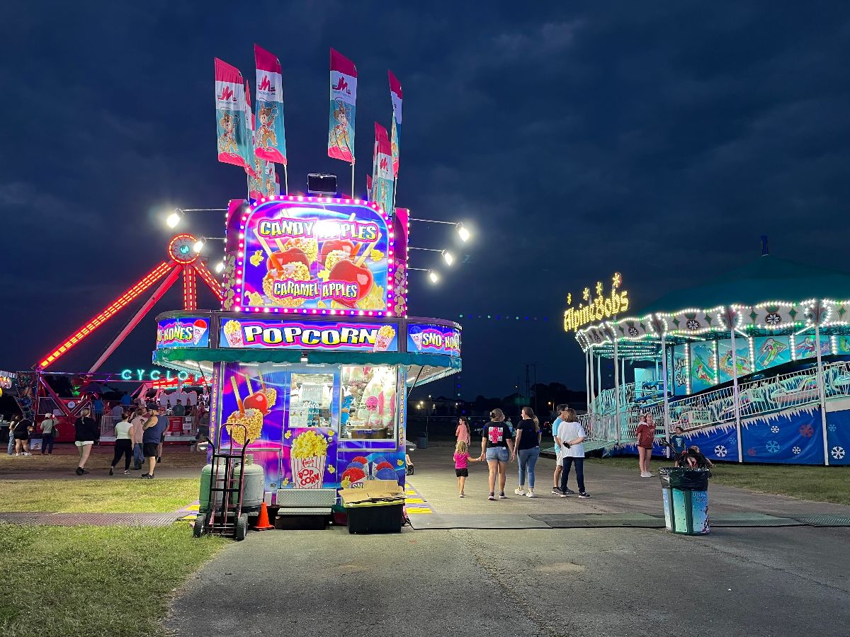 Ferris wheel and food stalls in Alabama county fair.