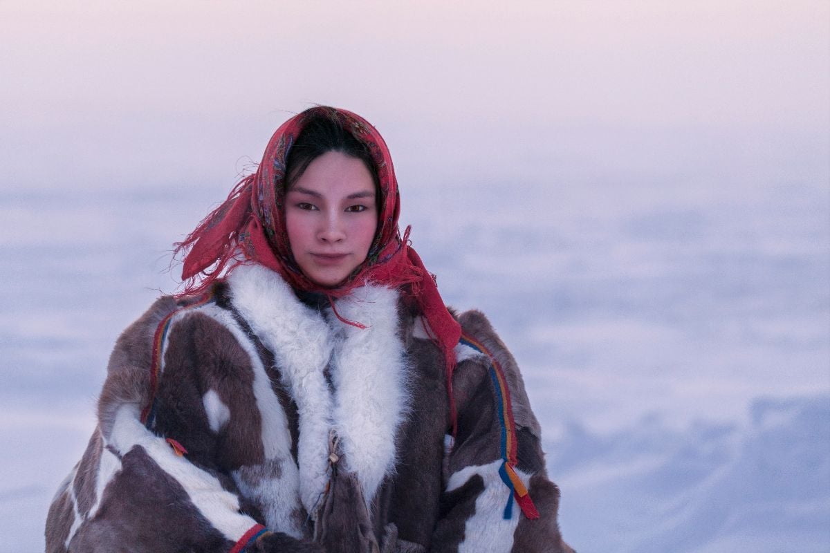 Young girl, in the national winter clothes of the northern inhabitants of the tundra, the Arctic circle.