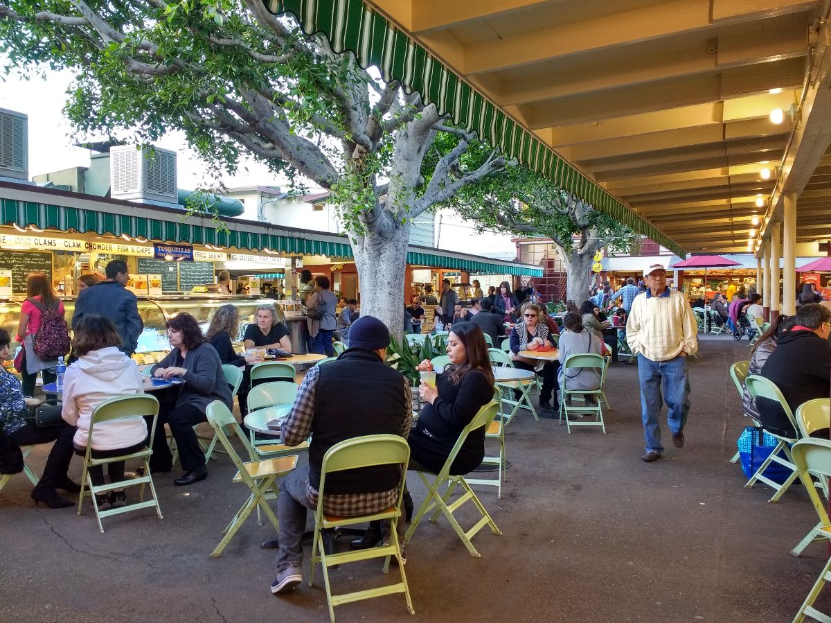 People eating lunch at the outdoor dining area.