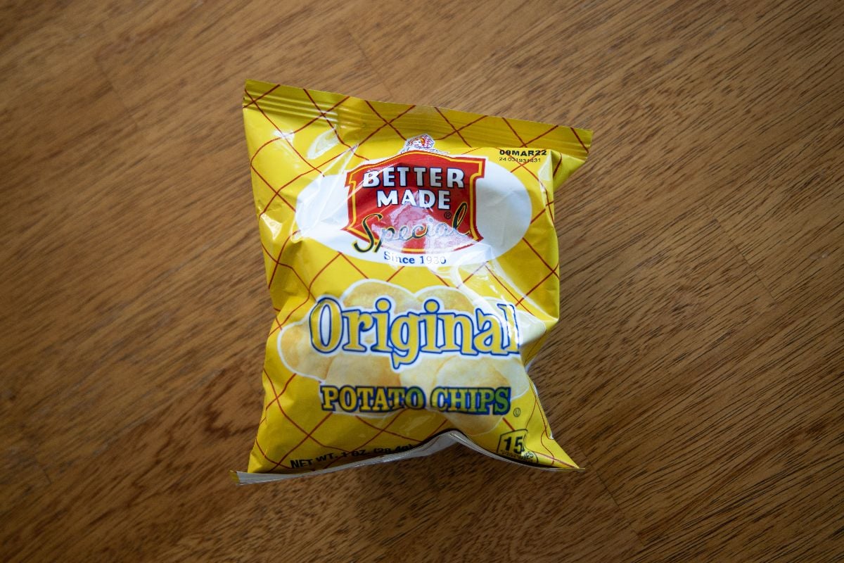 Better Made potato chips on a wooden table.