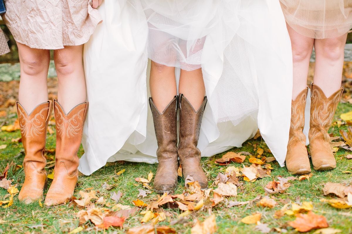 Bridesmaids wearing cowboy boots.