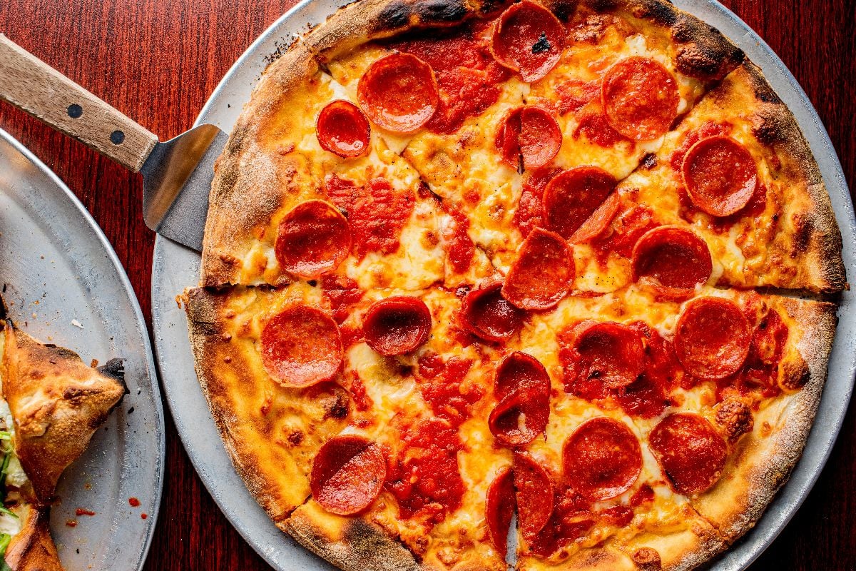 Buffalo-style pizza pie with pepperoni and a thin crispy crust.