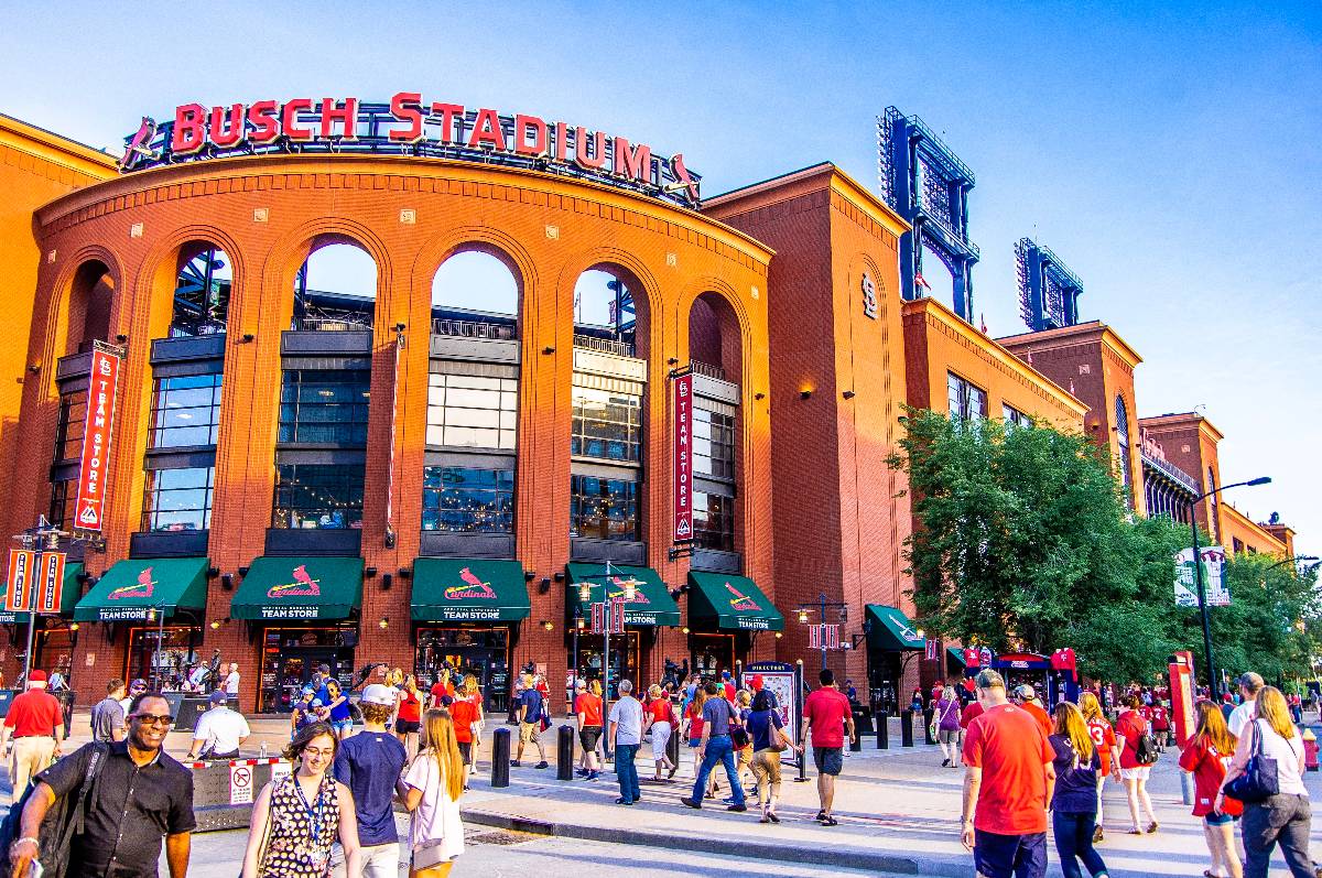 Crowds walks outside baseball venue prior to game.