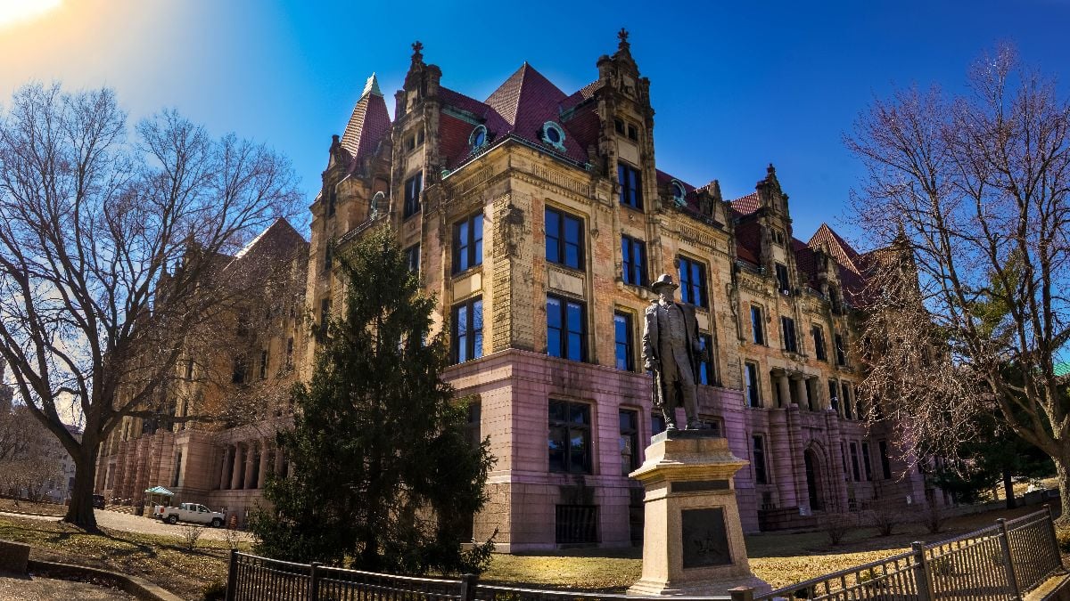Saint Louis city hall with statue of Lacleed stands in front of the classical architecture.