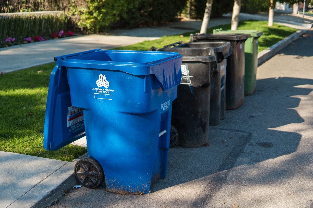 Plastic trash bins for organic, general household and recyclable waste.