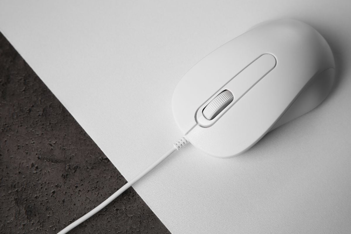 Wired mouse on a white mouse pad.