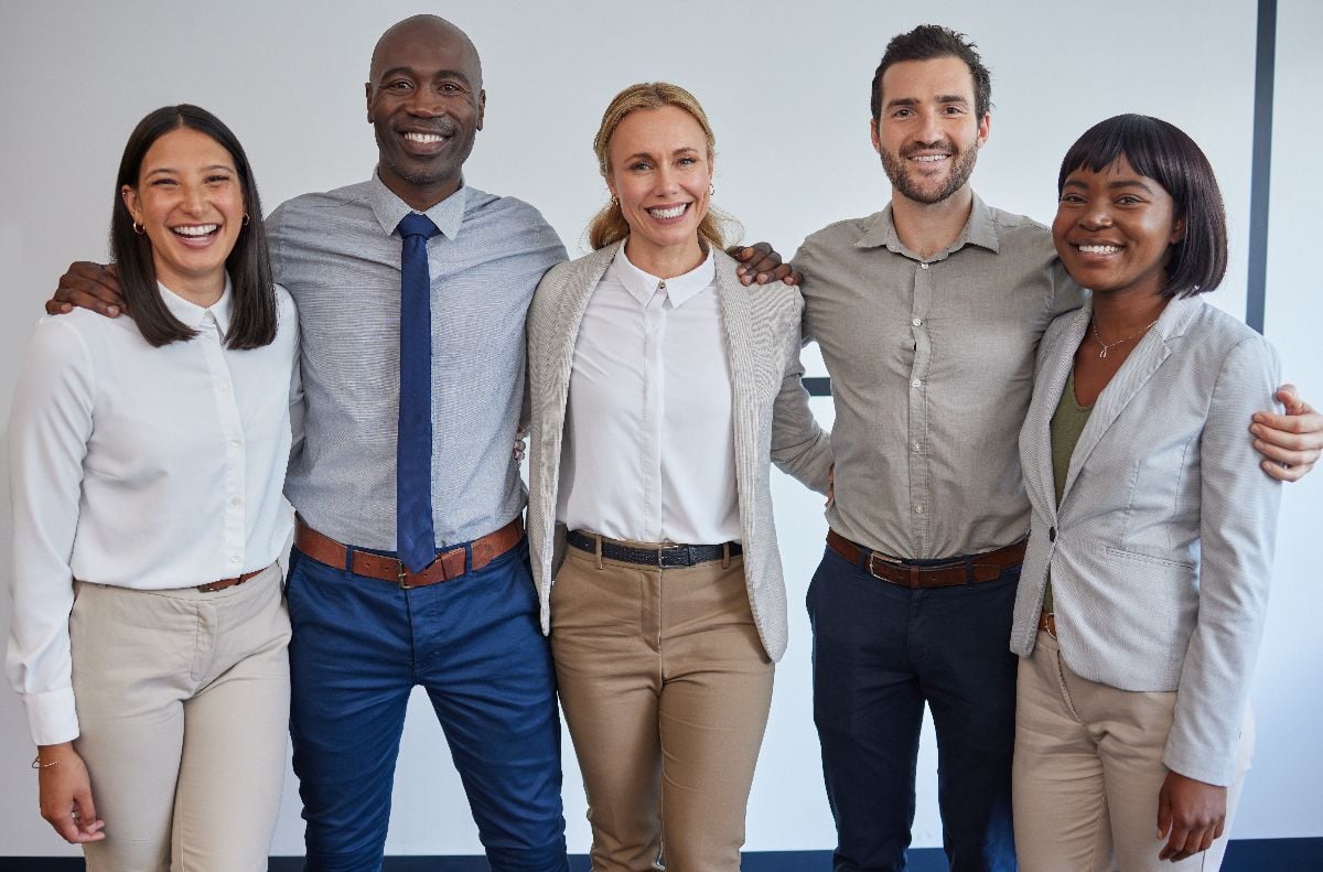 A group of corporate workers standing.