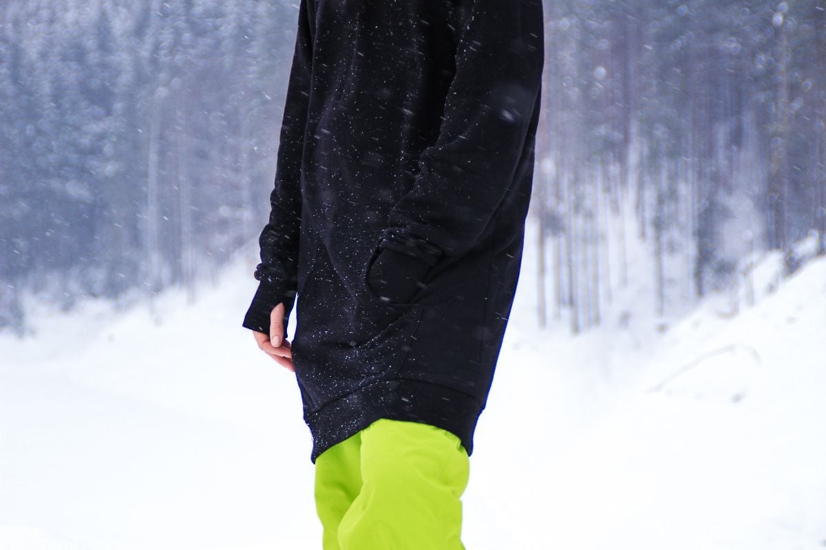 Close-up of woman wearing a cotton hoodie in the mountain.