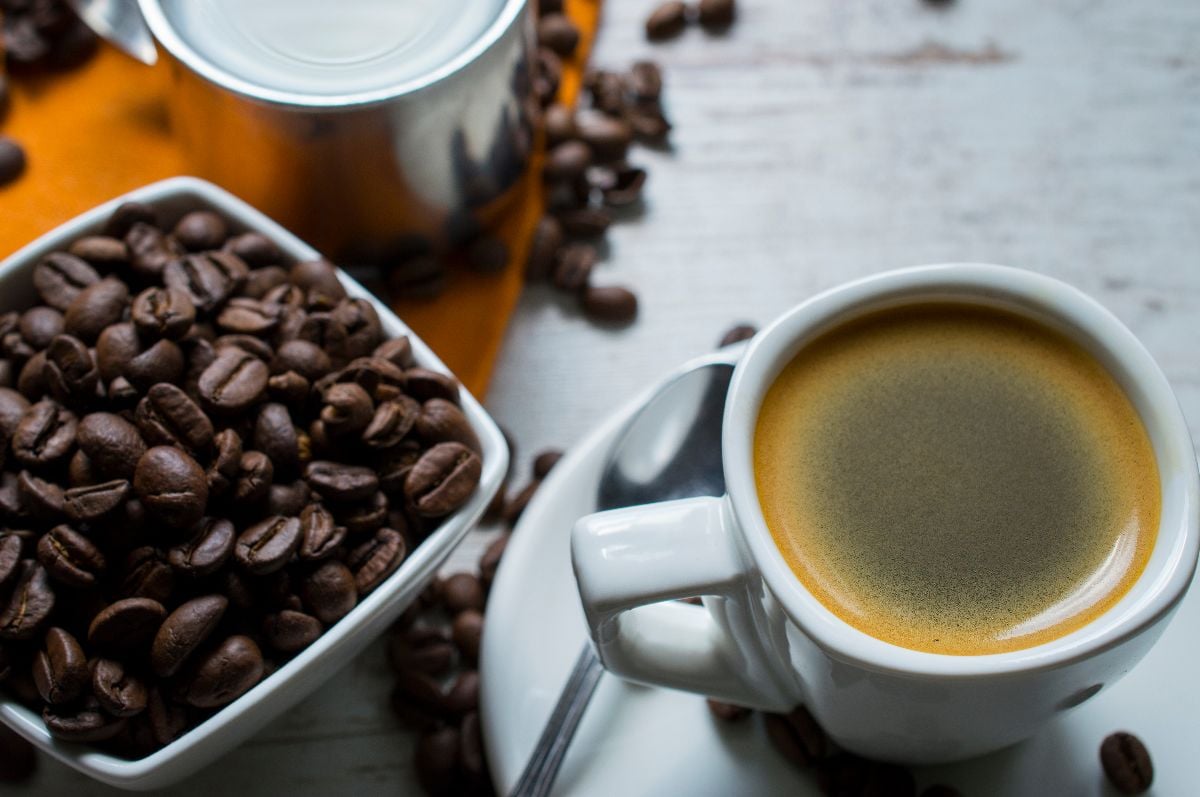 Cuban coffee and beans on the rustic table.
