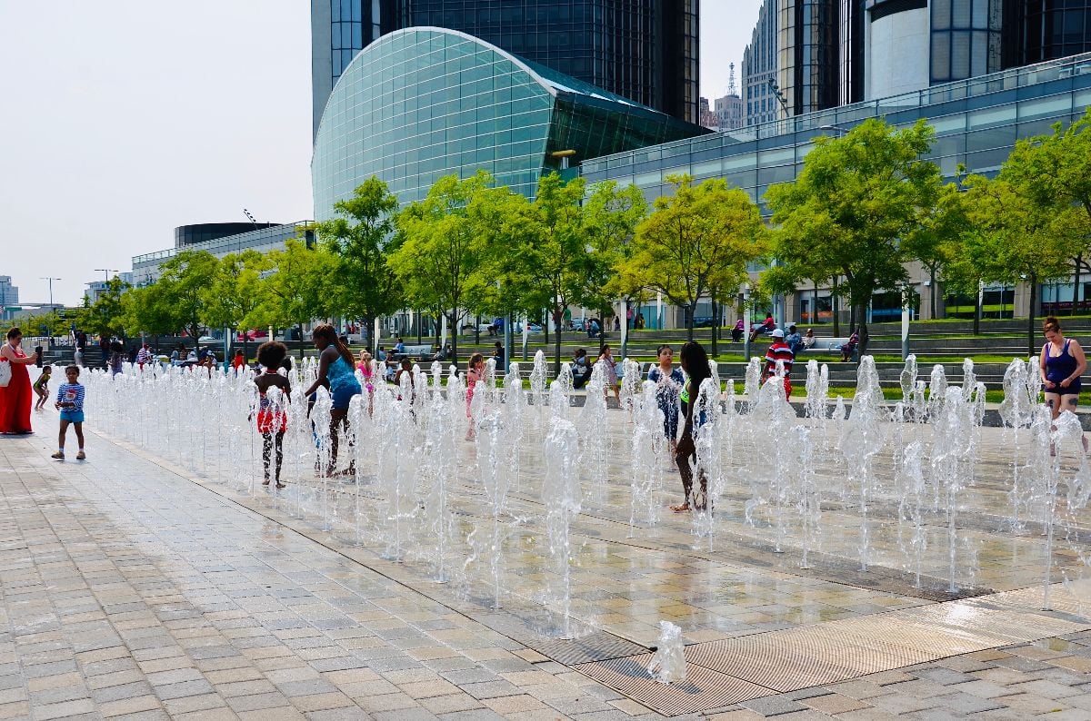 People enjoying a sunny summer day on RiverWalk.