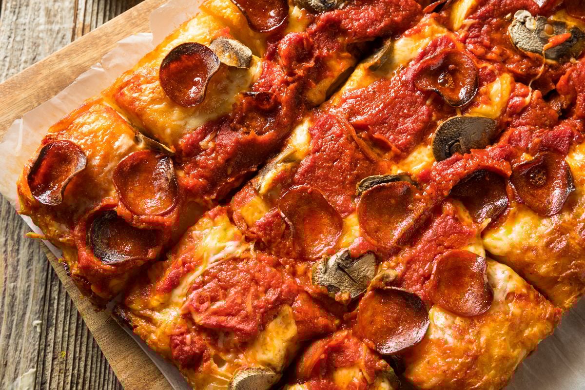 Homemade Detroit-style pepperoni pizza with mushrooms.