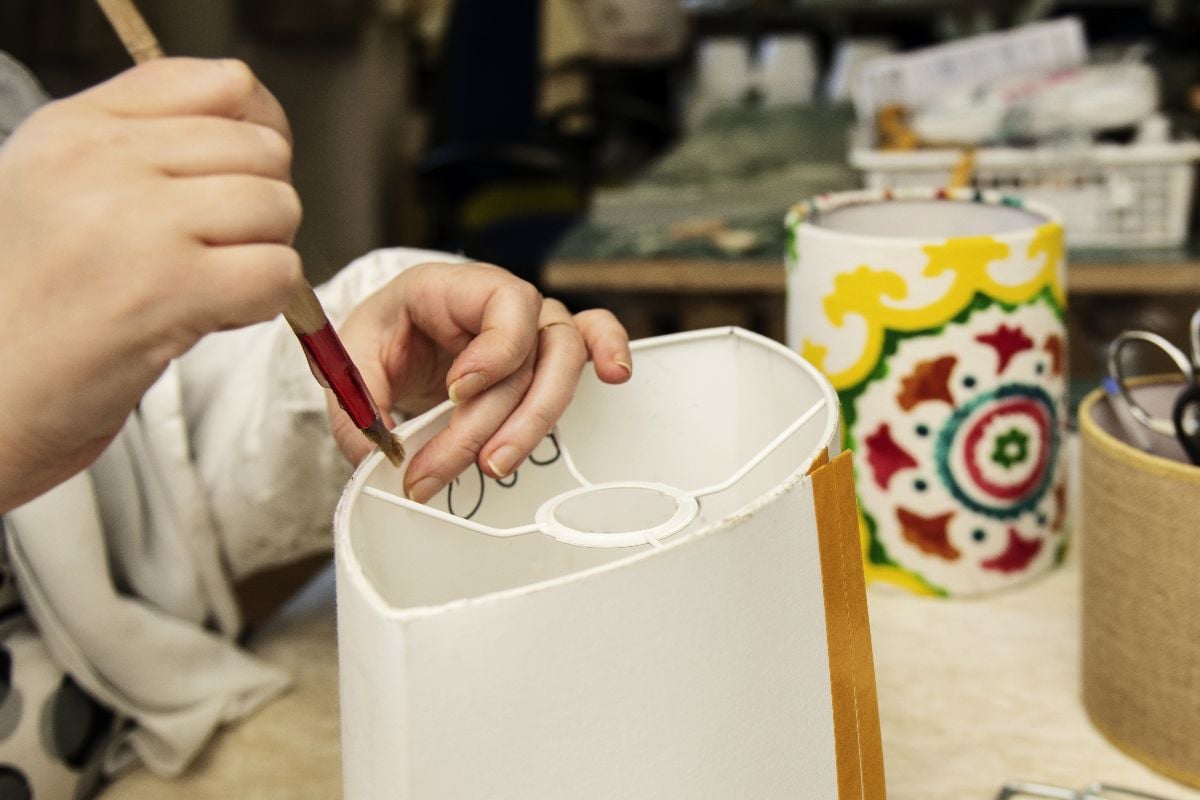 Woman making a diy lampshade.