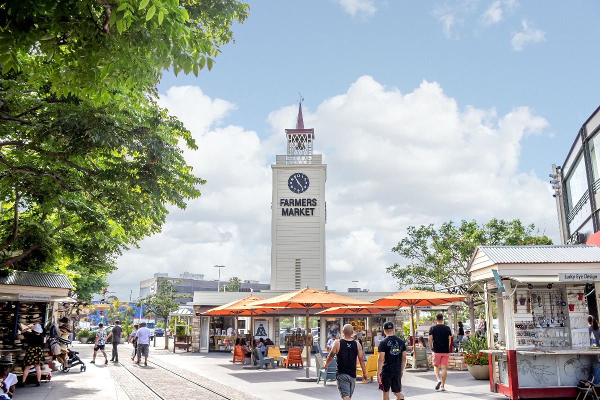 A view of people enjoying the sights of the Original Farmers Market.