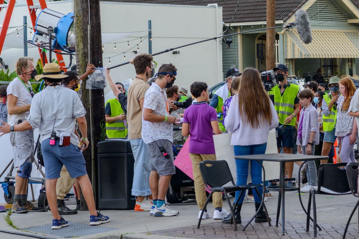 Film crew preparing to shoot at a coffee shop.