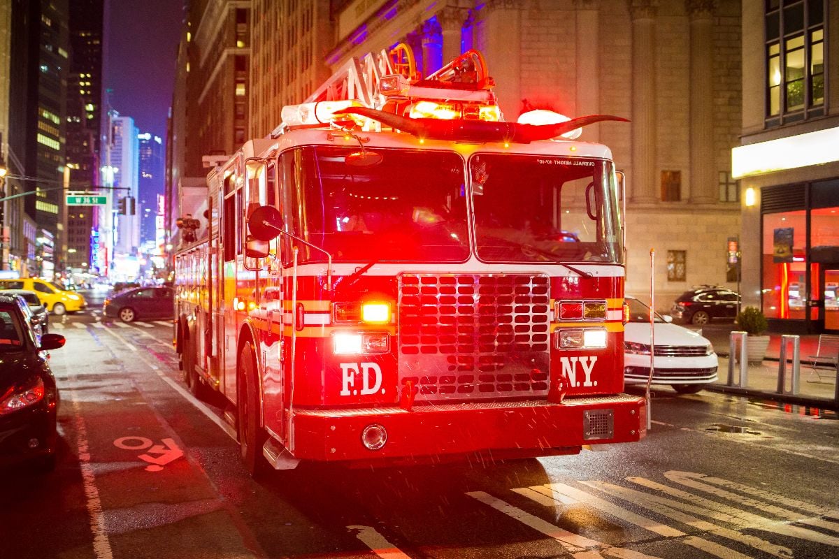 Fire truck with emergency lights on the street of Manhattan.