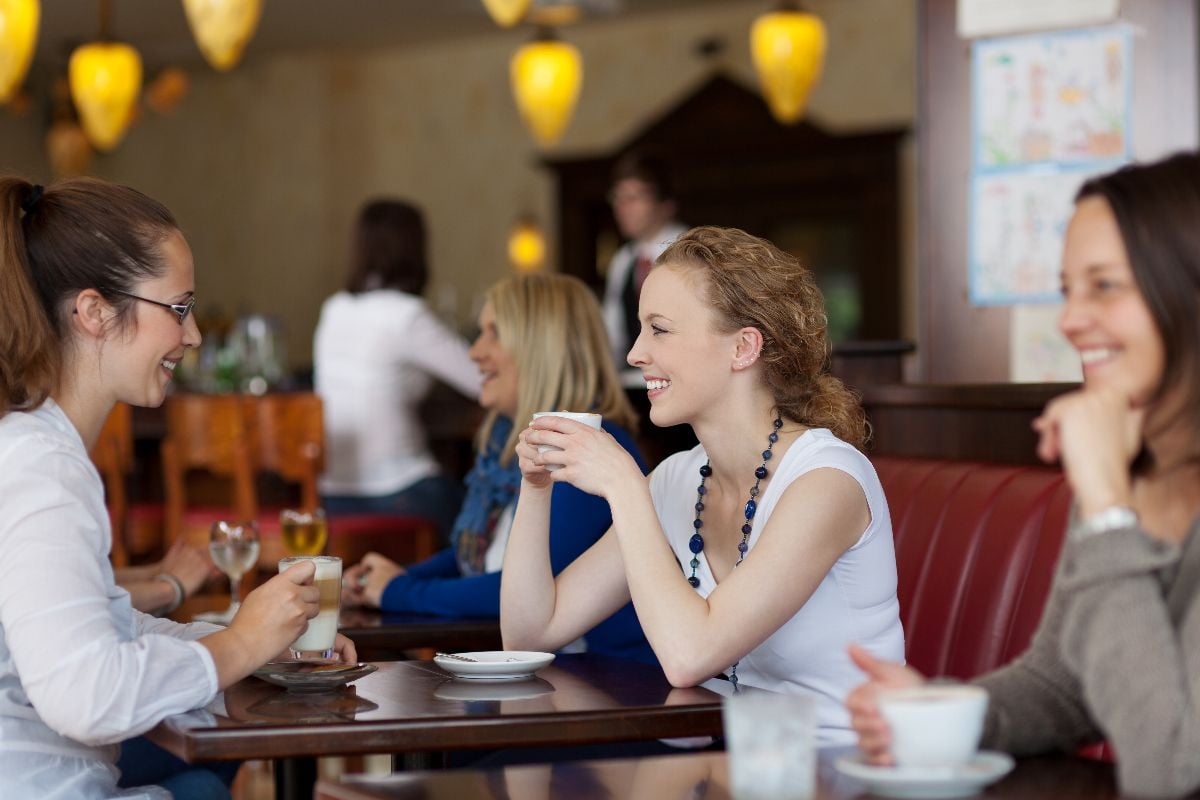 Friends enjoying coffee in a restaurant.