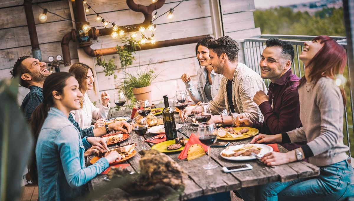 A group of friends eating meal together.