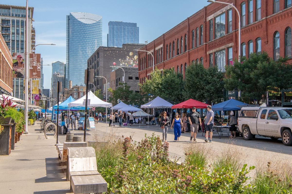 People enjoy a street fest in the Fulton Market District.