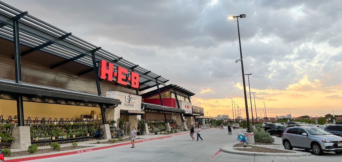 Panorama view store entrance of H-E-B grocery store.