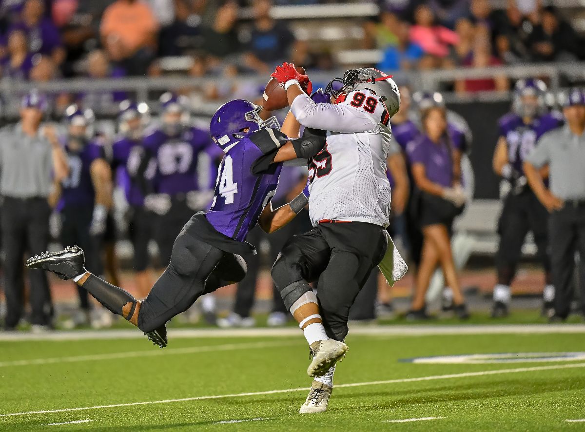 High School Football player in action.