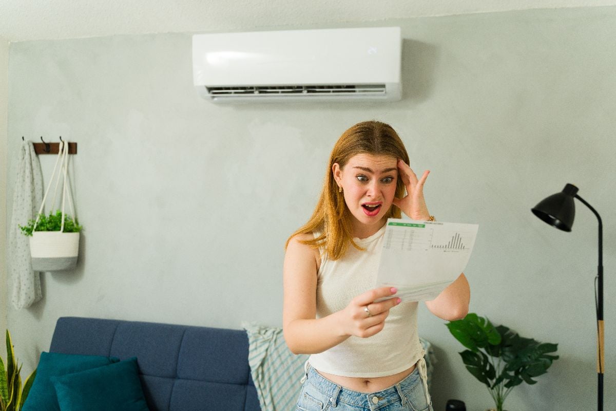 Woman shocked with her electricity bill.