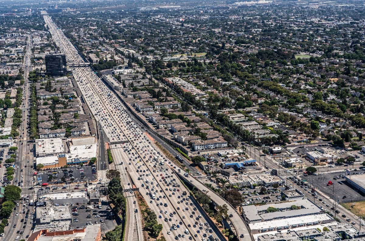 Aerial View of area around San Diego Freeway with massive traffic.