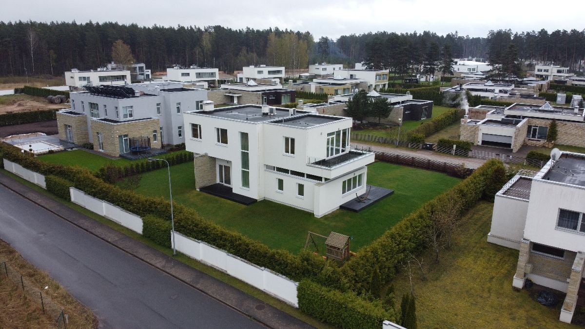 Aerial view of a village with white houses.