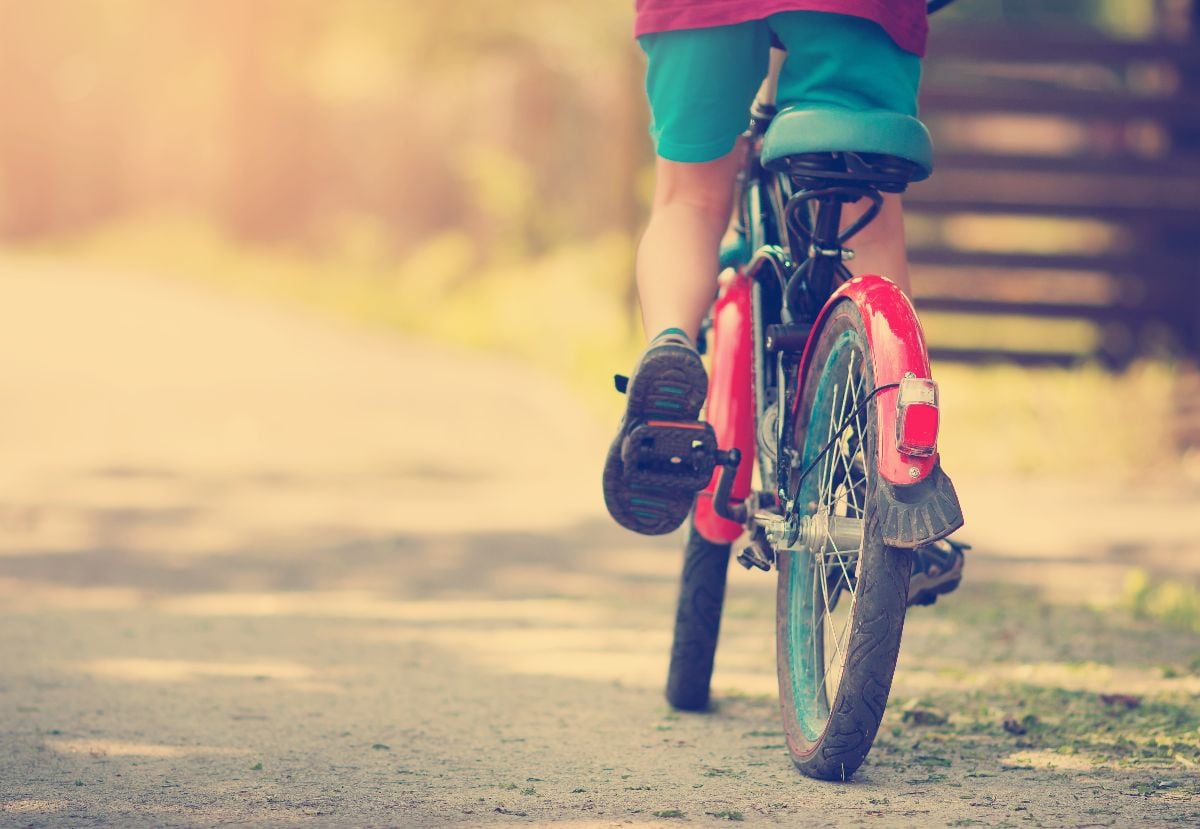 Kid riding a bike.