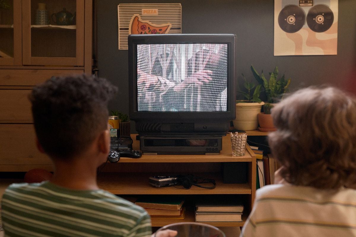 Kids watching TV at home.