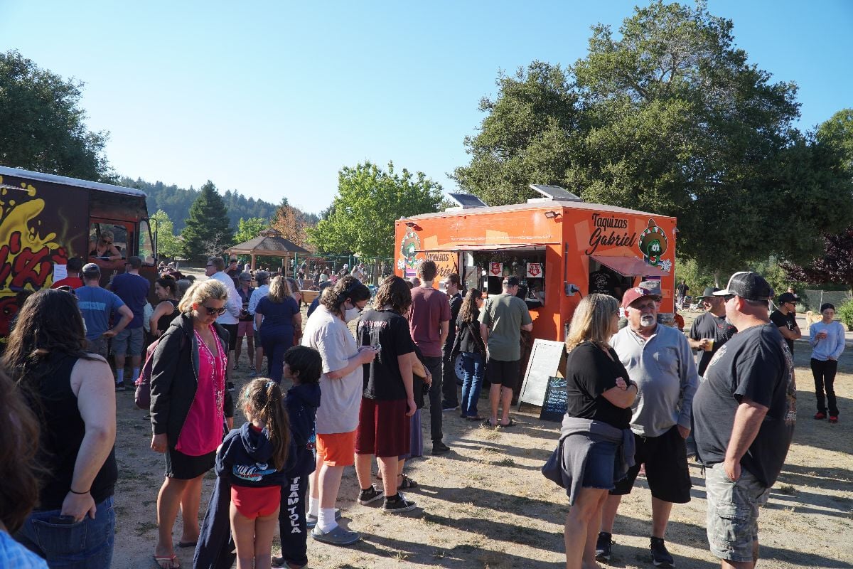 A food truck event in a city park.