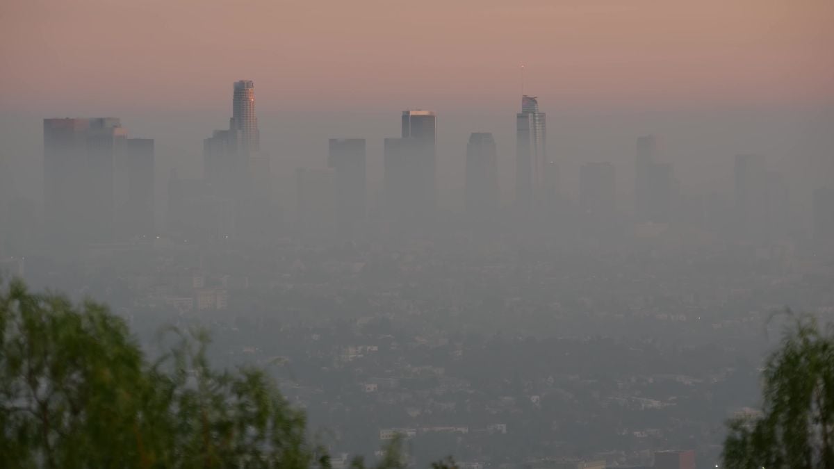 Highrise skyscrapers of metropolis in smog, Los Angeles, California USA.