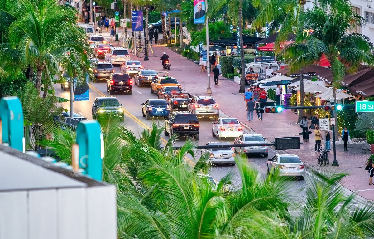 Car traffic in Miami Beach at dusk.