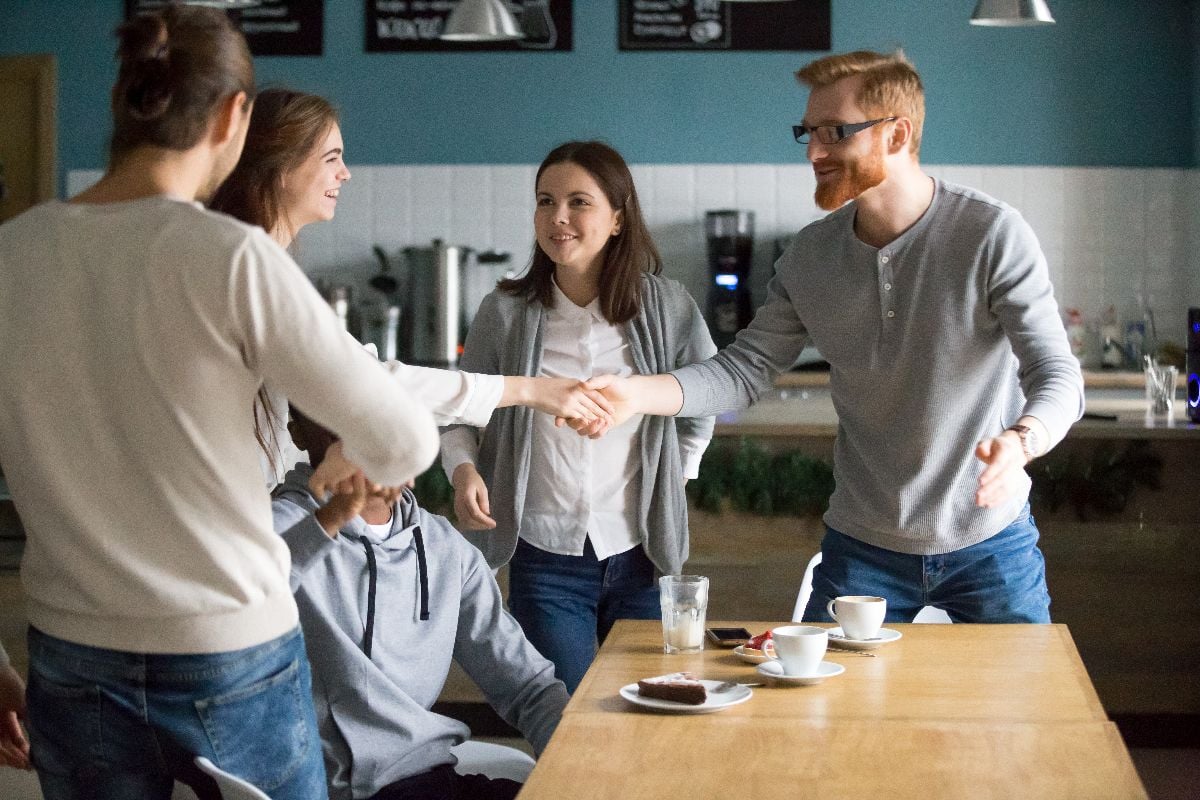 A group of people making new friends.