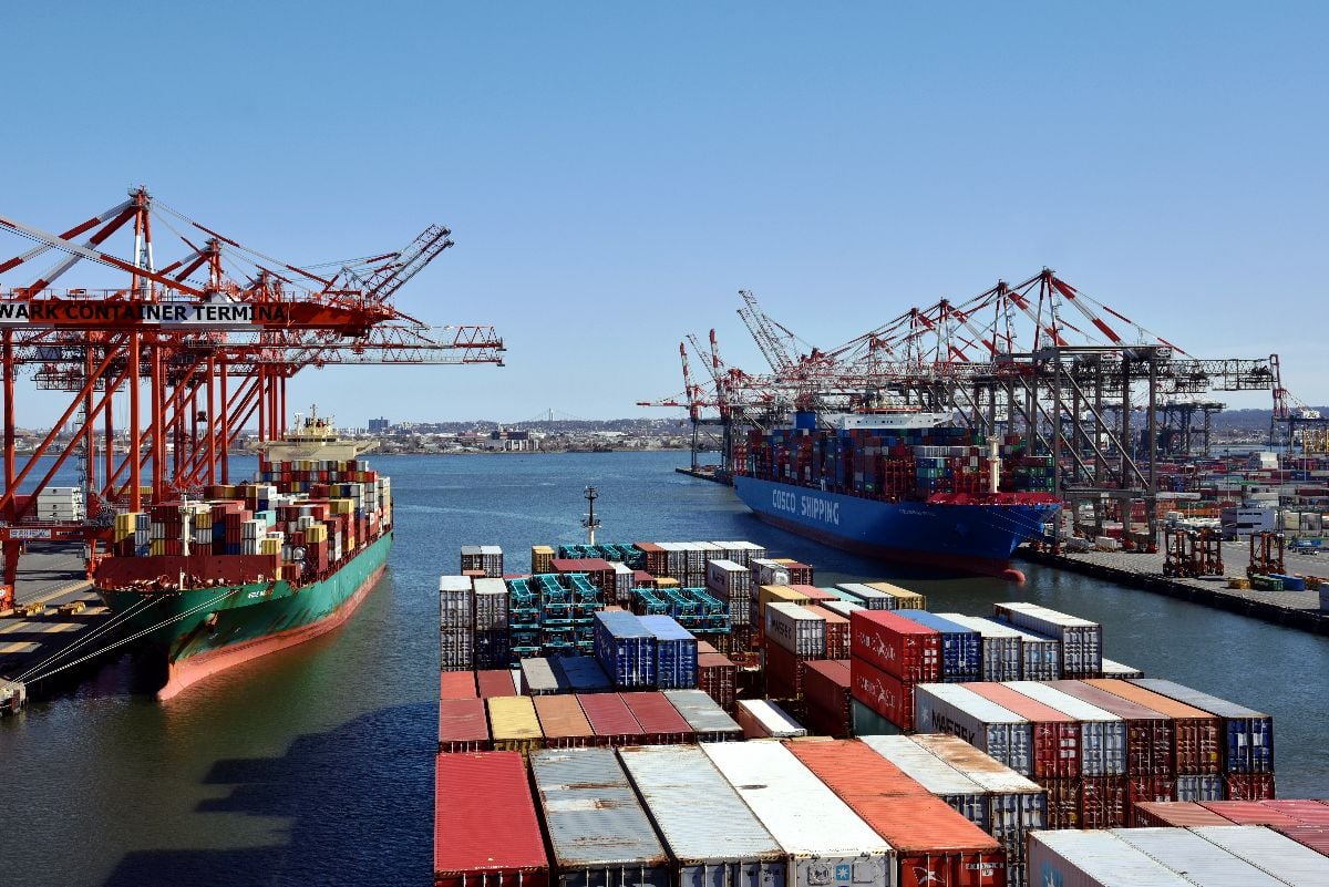 View of the container ships in Newark container terminal, where the gantry cranes are loading and discharging cargo from the vessels.