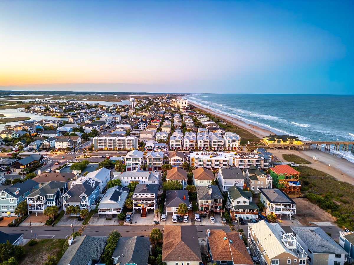 Aerial view of Wrightsville Beach houses at dusk.