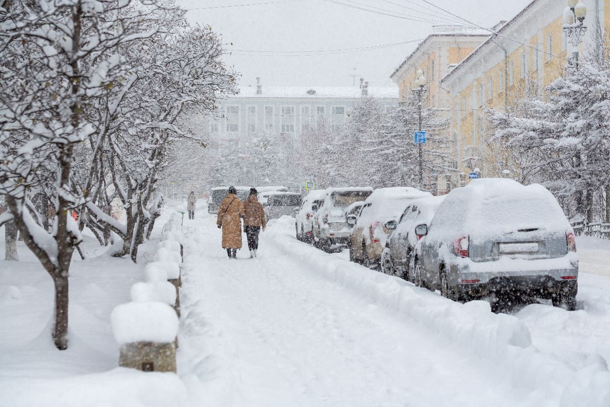 Snow covered city street during a heavy snowfall.