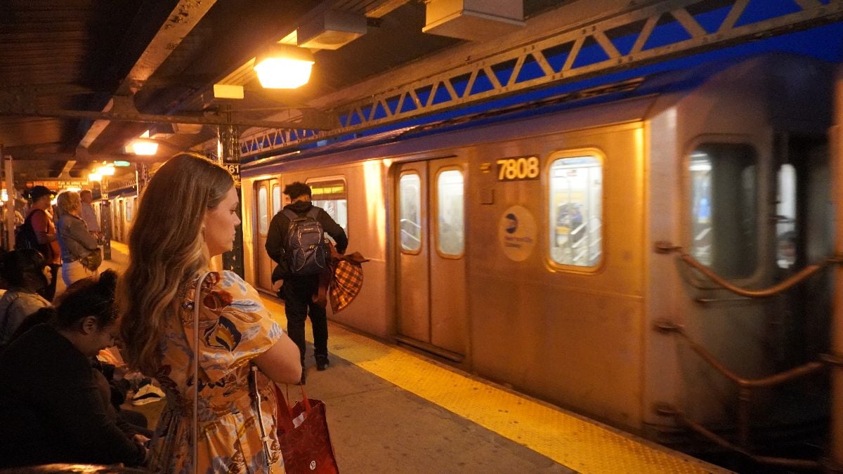 People waiting for train in subway train.