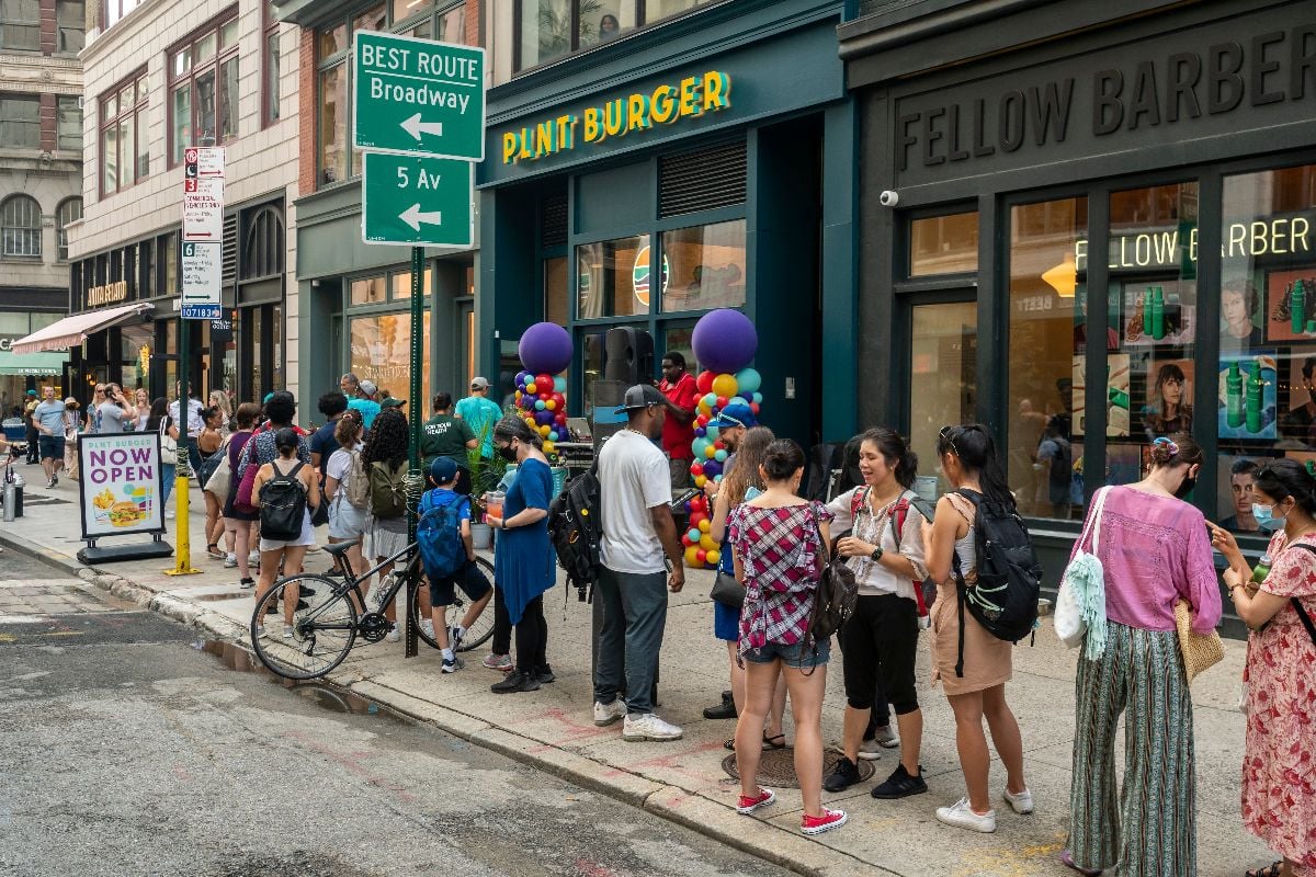 People line up at the opening of a branch of the PLNT Burger meatless restaurant chain.