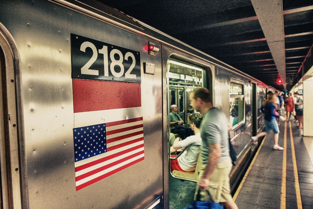 People boarding NYC subway train.