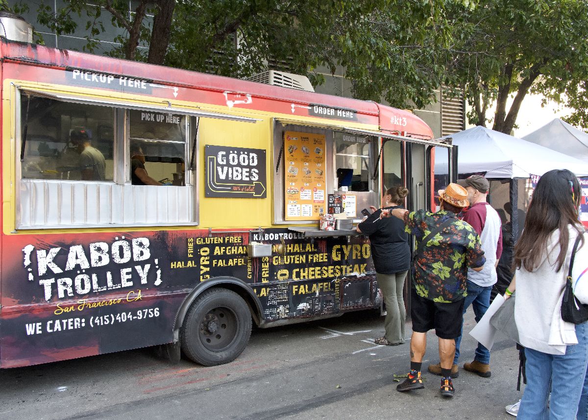 People waiting in line on food truck.