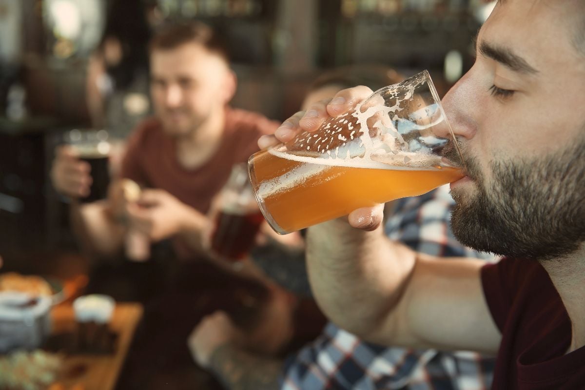 Man drinking a beer.