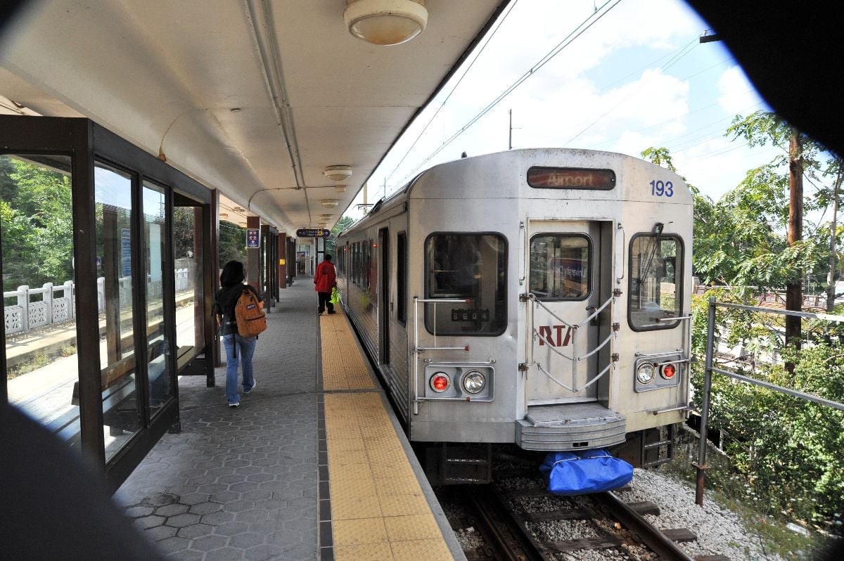 Passengers board RTA train