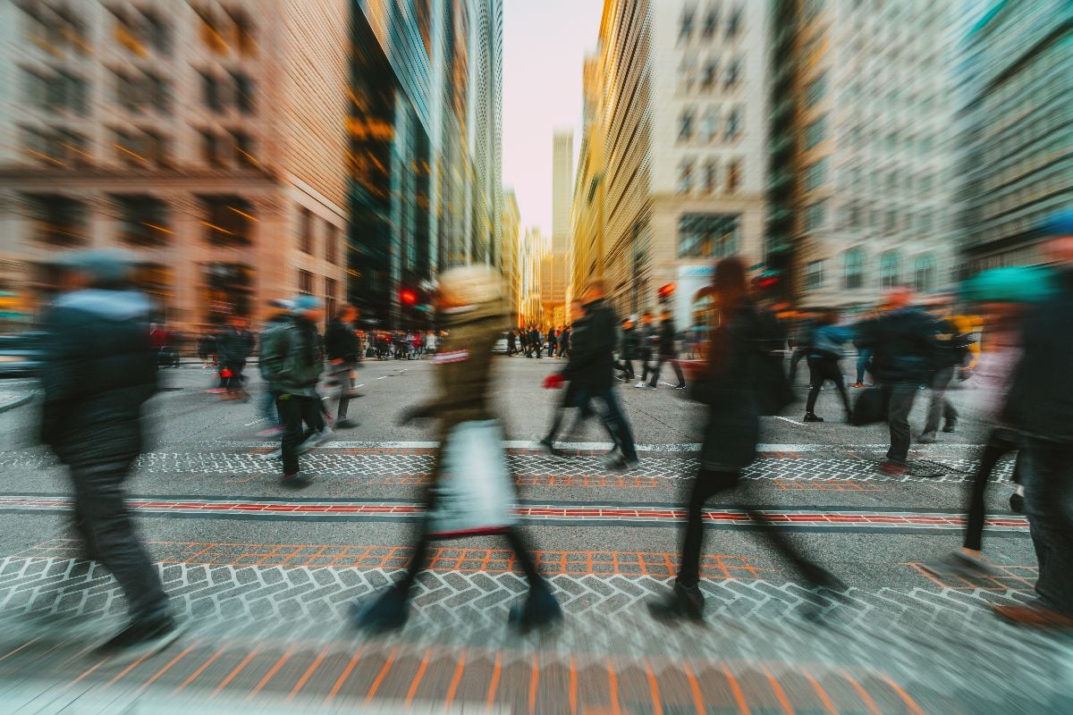 Blurred Crowd of unrecognizable business people walking on zebra crossing.