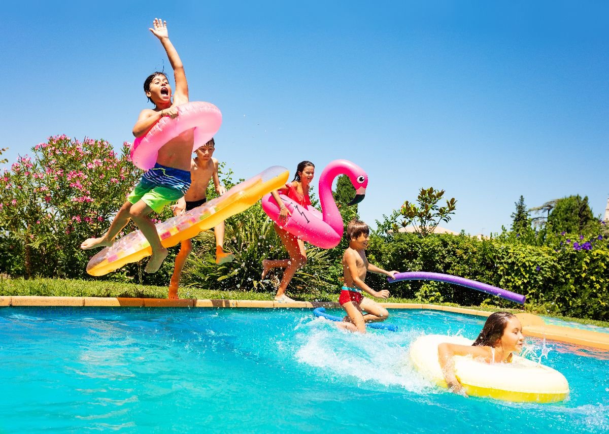 Friends with floaters on pool.