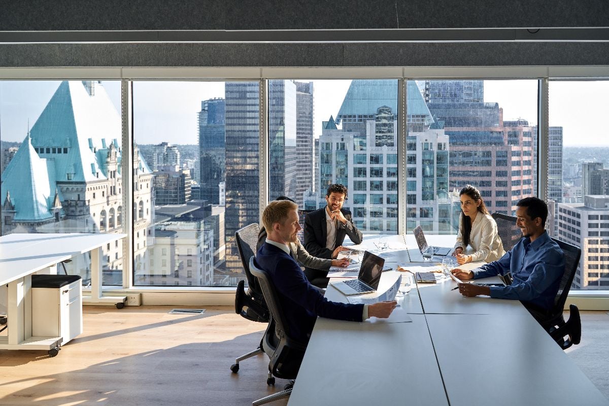 Young professional board executives working together in meeting room.