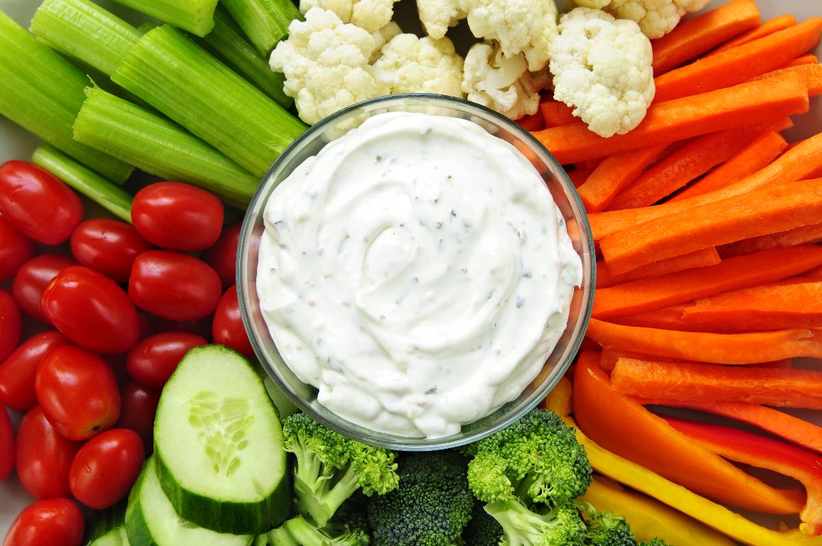 Platter of assorted fresh vegetables with a ranch dip.