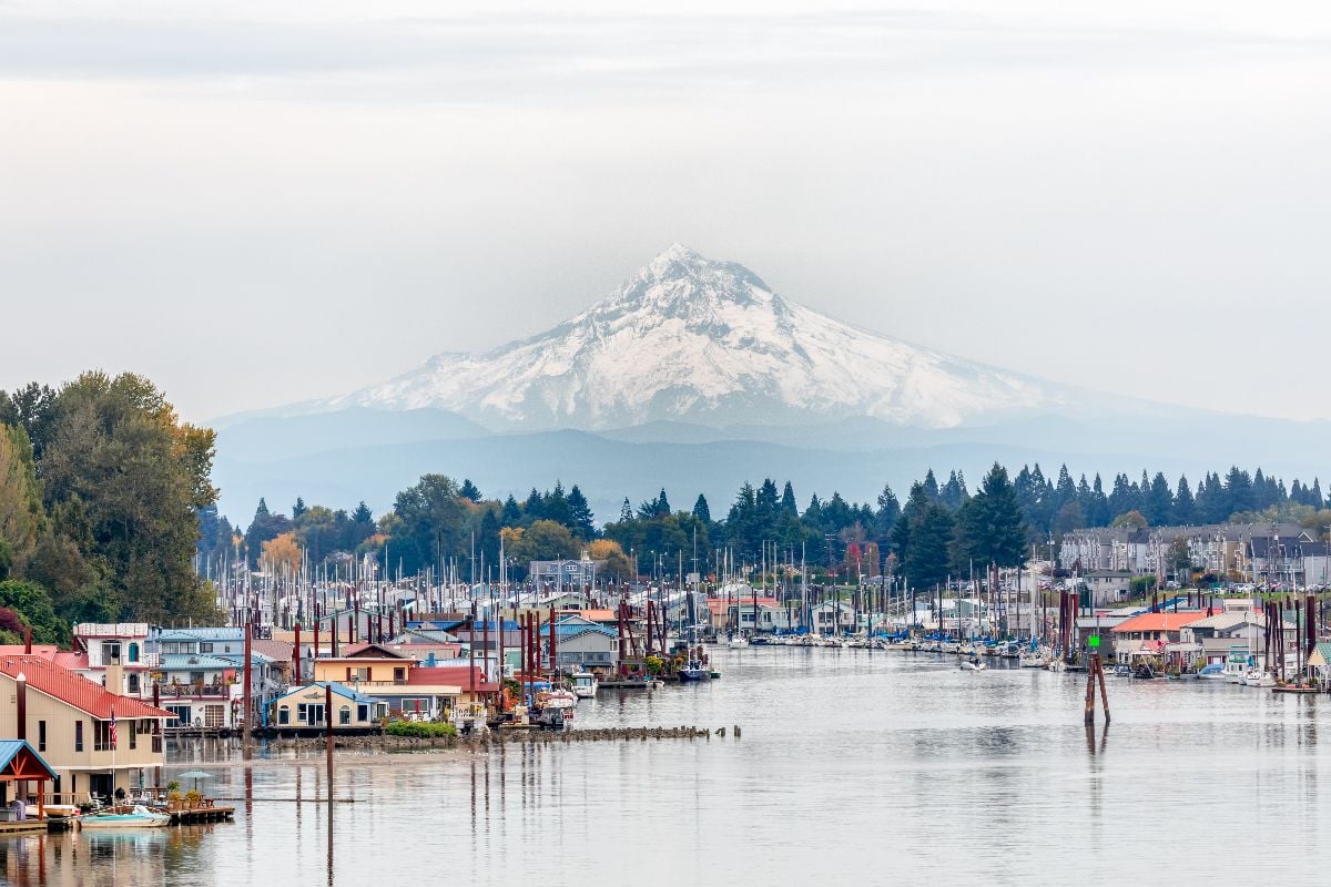 View of Mt. Hood and Portland Marina floating boat houses in Oregon.