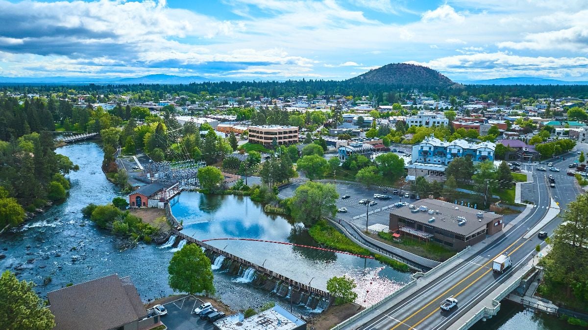 Aerial fly over riverfront community in Bend Oregon.